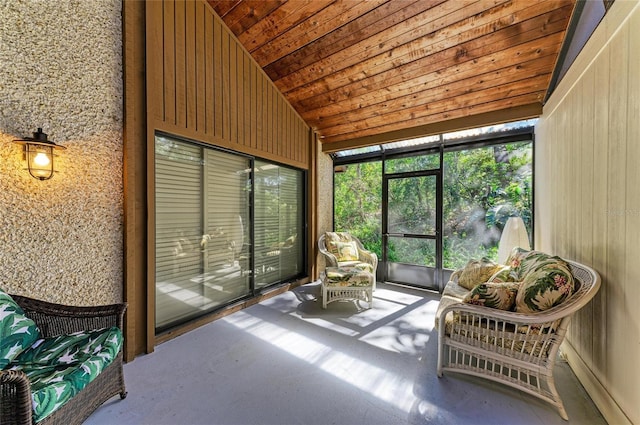 sunroom featuring lofted ceiling and wood ceiling