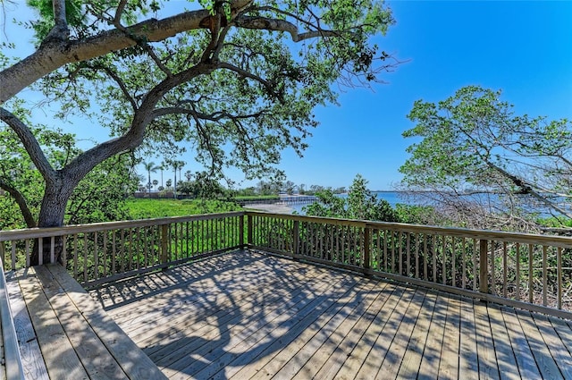 wooden deck featuring a water view