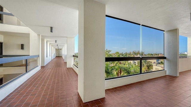 corridor with dark tile patterned flooring