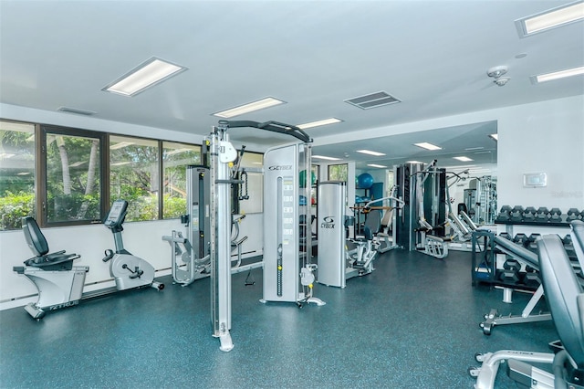 exercise room featuring visible vents