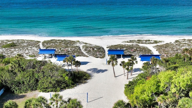 drone / aerial view with a water view and a view of the beach