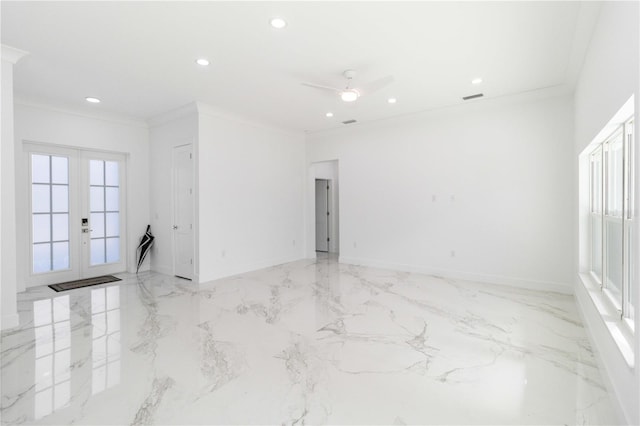 empty room featuring french doors, ceiling fan, and ornamental molding