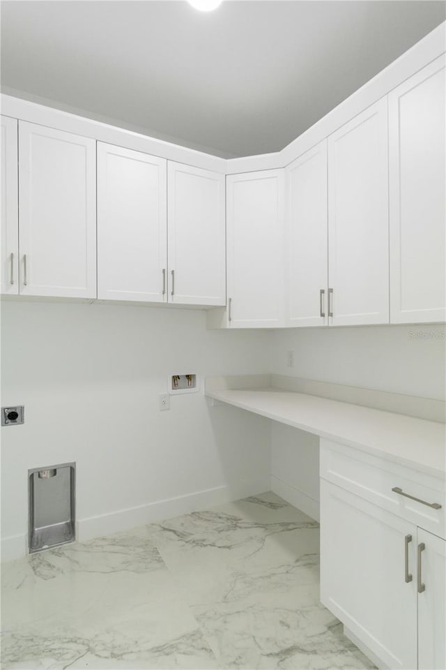 clothes washing area featuring cabinets, electric dryer hookup, and hookup for a washing machine