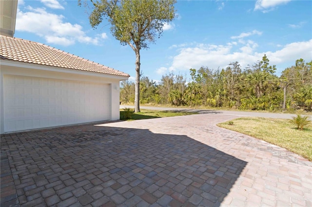 view of patio featuring a garage