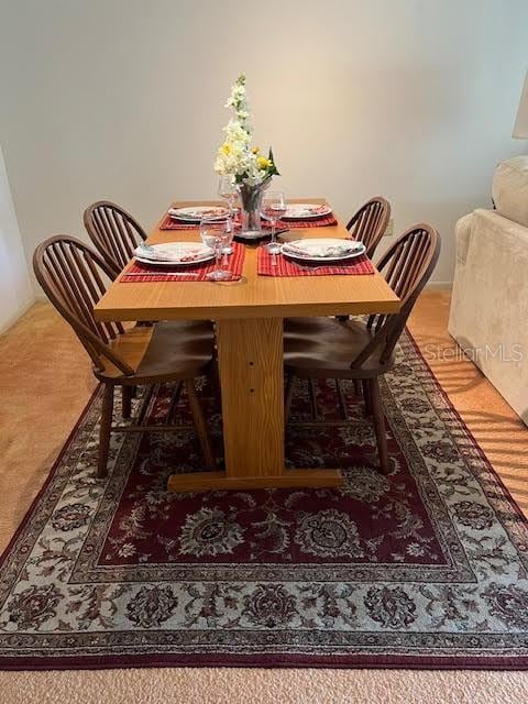 view of carpeted dining space