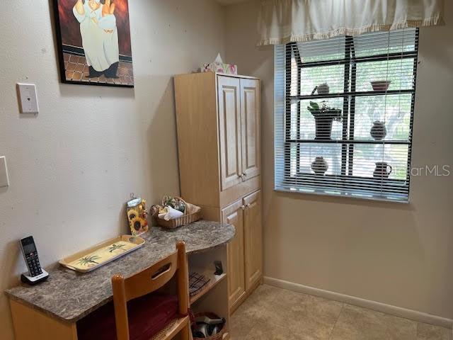 mudroom with light tile patterned flooring