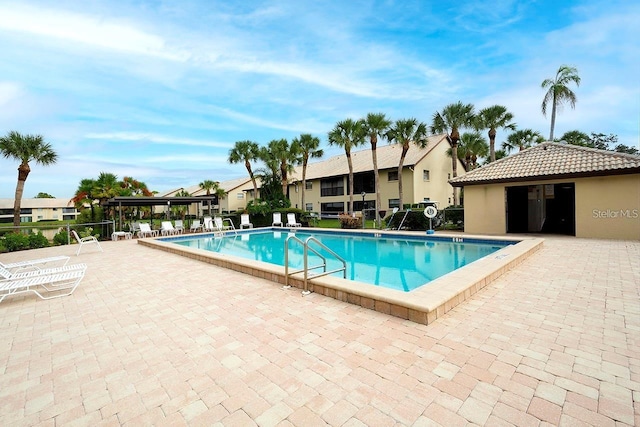 view of swimming pool featuring a patio area