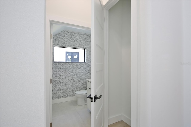 bathroom featuring tile patterned floors and toilet