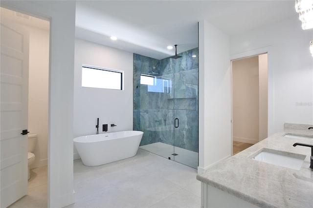 full bathroom featuring toilet, vanity, and shower with separate bathtub