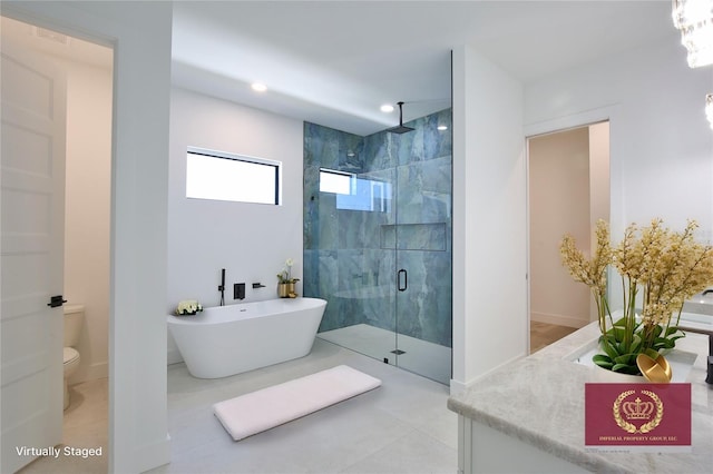 full bathroom with vanity, tile patterned flooring, shower with separate bathtub, and toilet