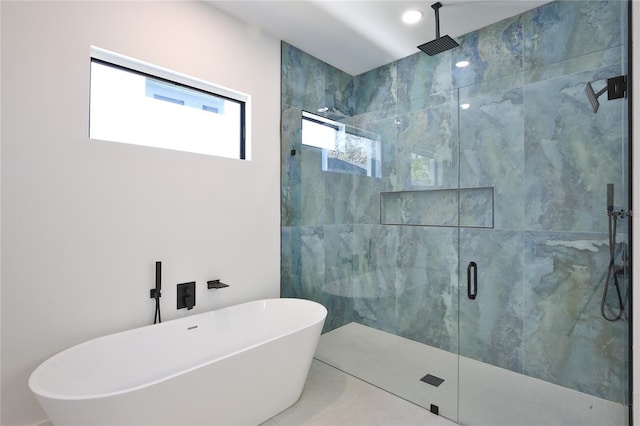 bathroom with shower with separate bathtub