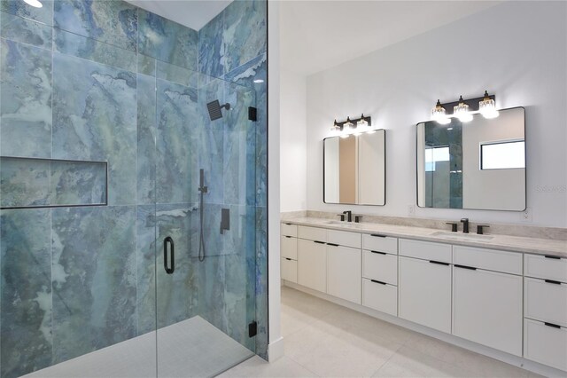 bathroom featuring vanity, tile patterned flooring, and a shower with door