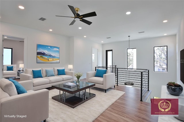 living room with light hardwood / wood-style flooring