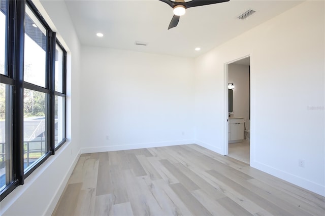 spare room with ceiling fan and light hardwood / wood-style floors