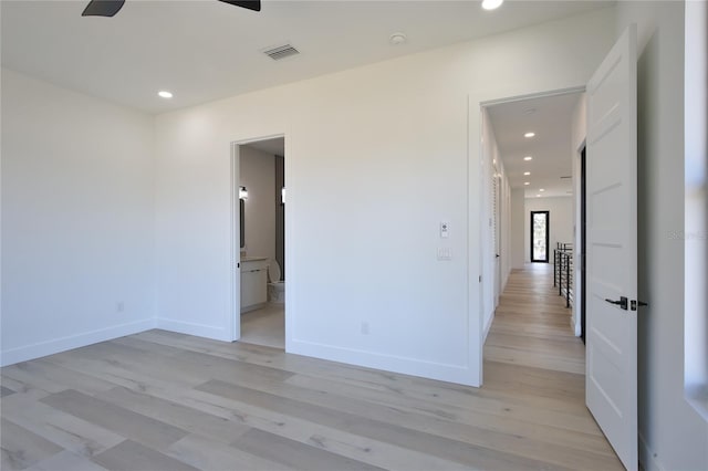 spare room with light hardwood / wood-style floors and ceiling fan