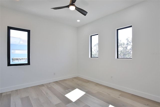 unfurnished room featuring light hardwood / wood-style floors and ceiling fan