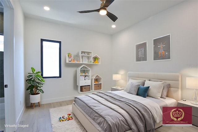 bedroom featuring ceiling fan and light hardwood / wood-style floors