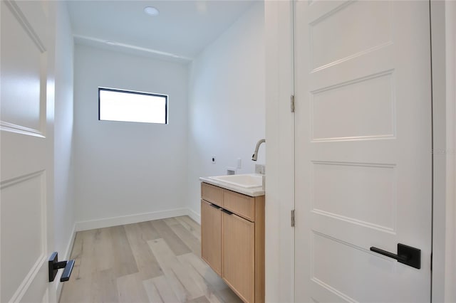 bathroom with vanity and hardwood / wood-style floors