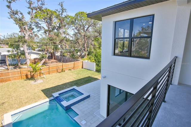 view of swimming pool with an in ground hot tub, a patio area, and a lawn