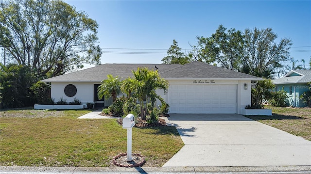 single story home featuring a garage and a front yard