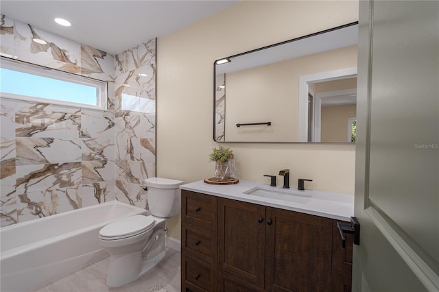 full bathroom with vanity, toilet, and tiled shower / bath combo