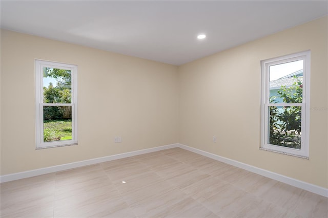 spare room featuring a wealth of natural light