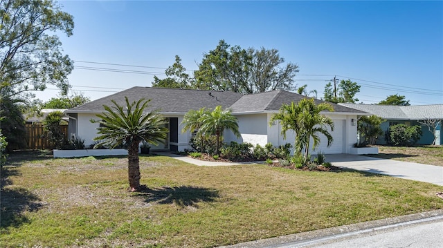 ranch-style home with a garage and a front yard