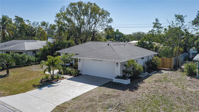 ranch-style house with a garage and a front yard