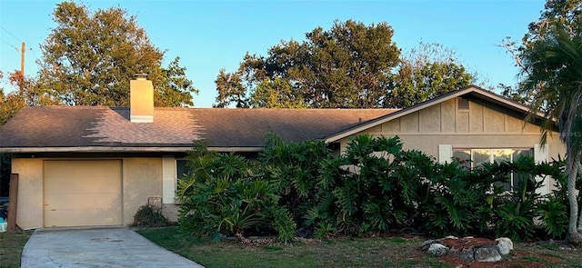 single story home with a garage