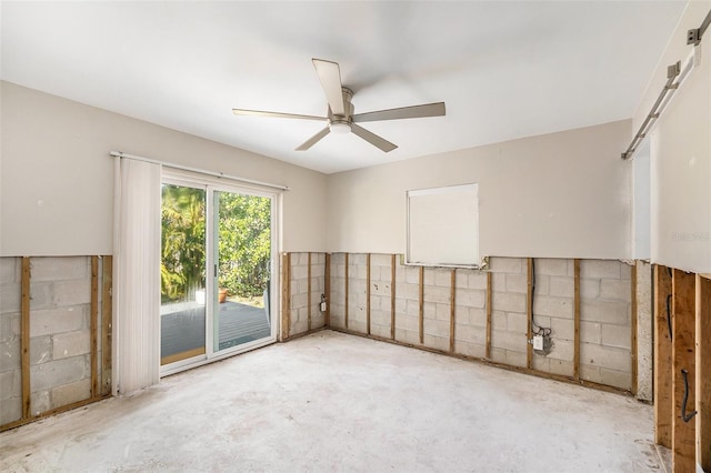 empty room with concrete flooring and ceiling fan