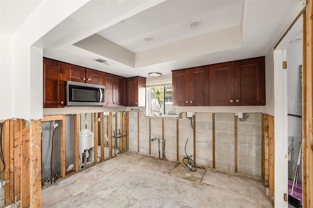 kitchen featuring a tray ceiling