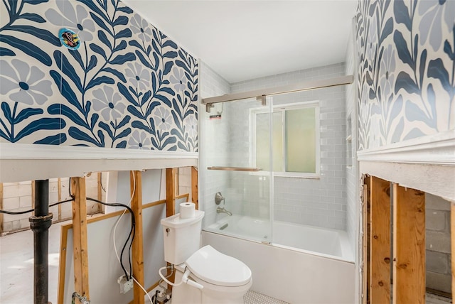 bathroom with shower / bath combination with glass door and toilet