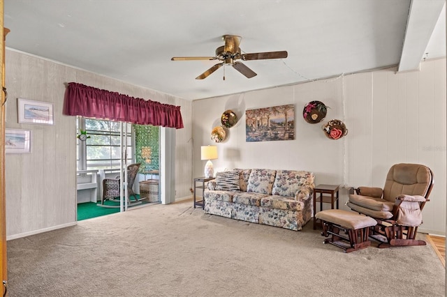 carpeted living room featuring ceiling fan