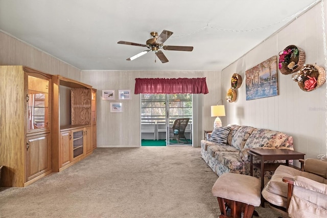 living room featuring light carpet and ceiling fan