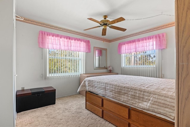 carpeted bedroom with ceiling fan