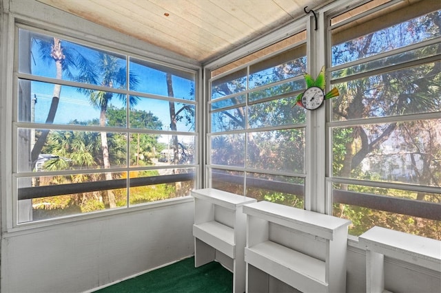 sunroom featuring wooden ceiling