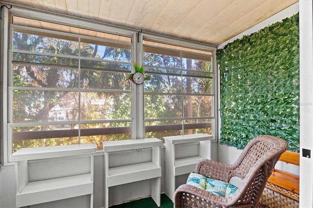 sunroom featuring wood ceiling