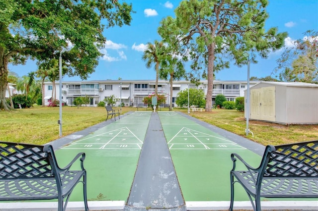 view of home's community featuring a lawn