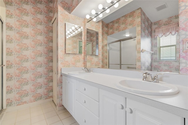 bathroom with vanity, tile patterned floors, and walk in shower