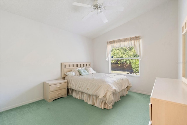 bedroom with ceiling fan, lofted ceiling, and light carpet