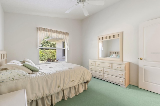 bedroom featuring ceiling fan and light carpet