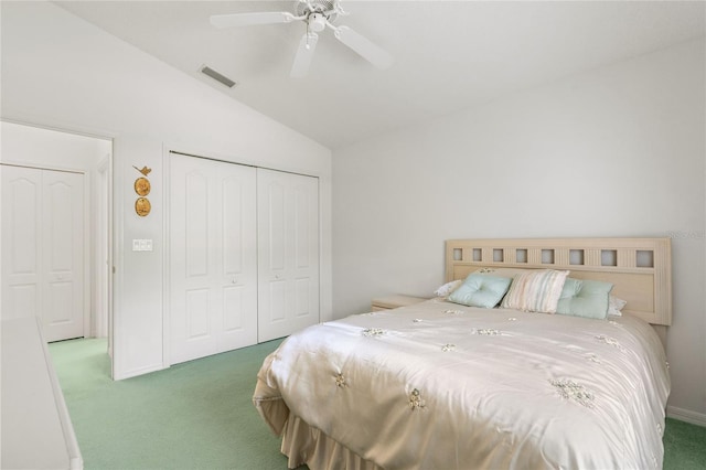 carpeted bedroom with lofted ceiling, ceiling fan, and a closet