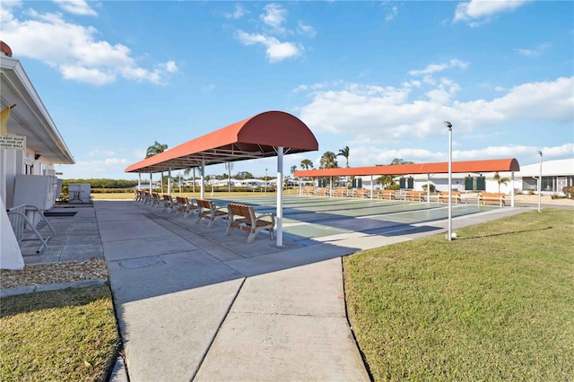 view of property's community with a lawn