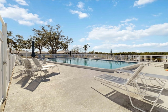 view of swimming pool featuring a patio