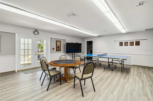 game room featuring light hardwood / wood-style floors and french doors
