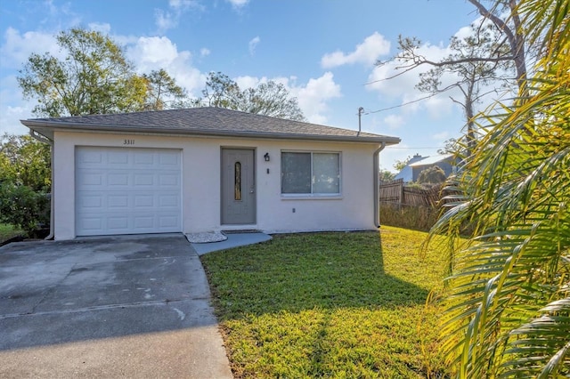 view of front of home featuring a garage and a front lawn