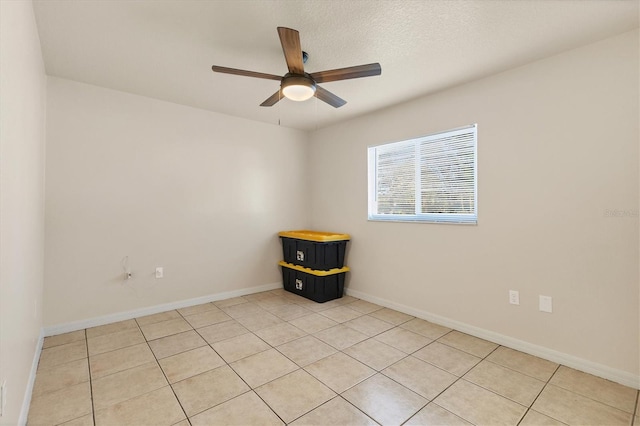 spare room with ceiling fan