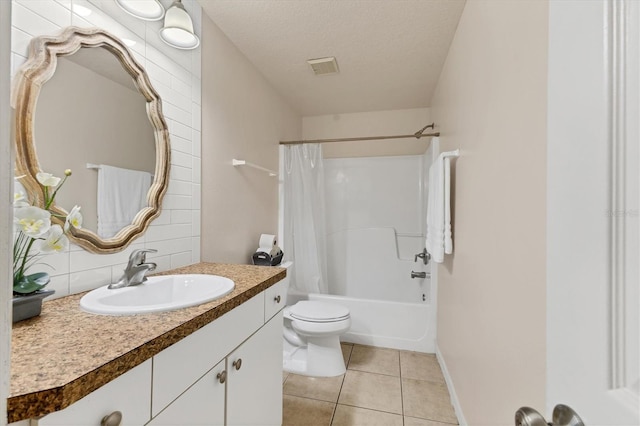 full bathroom with tile patterned floors, toilet, a textured ceiling, vanity, and shower / bath combo