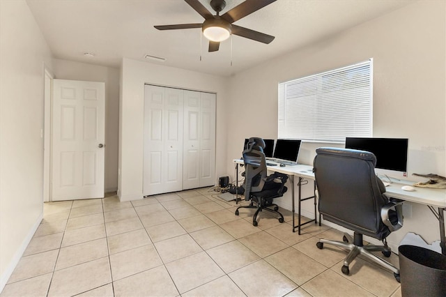 office space with light tile patterned floors and ceiling fan