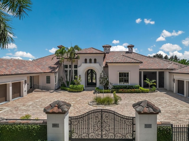 rear view of property with a garage